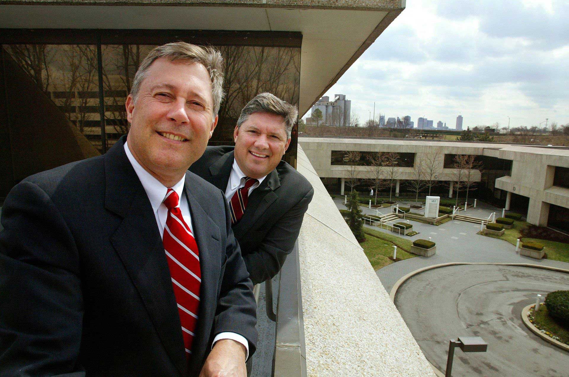 Group hanging out, looking at their smartphones